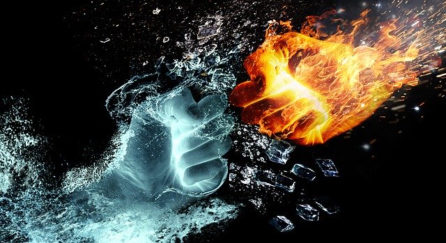 Two fists approaching one-another, one fire and one ice. 