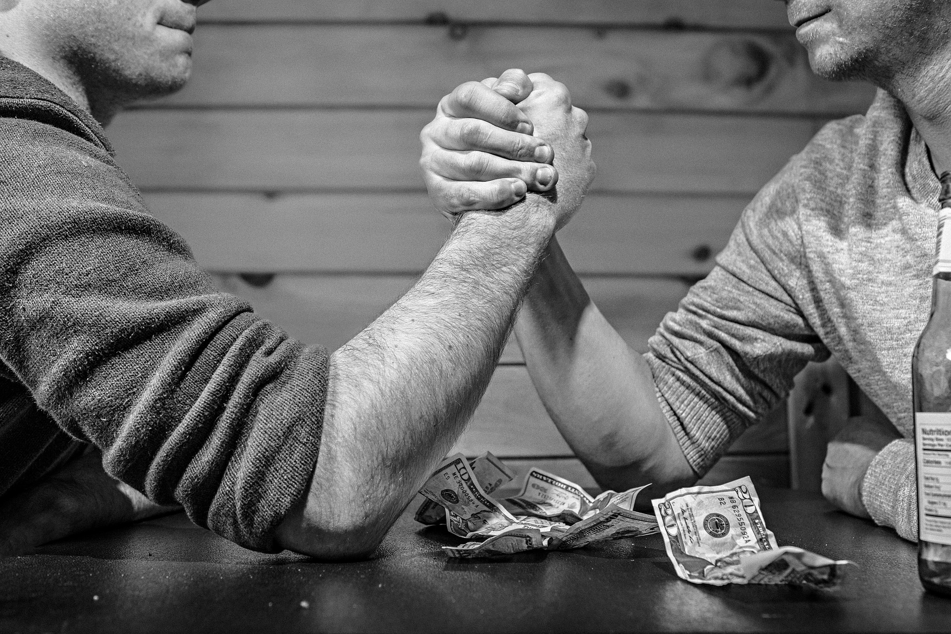 arm wrestle over money