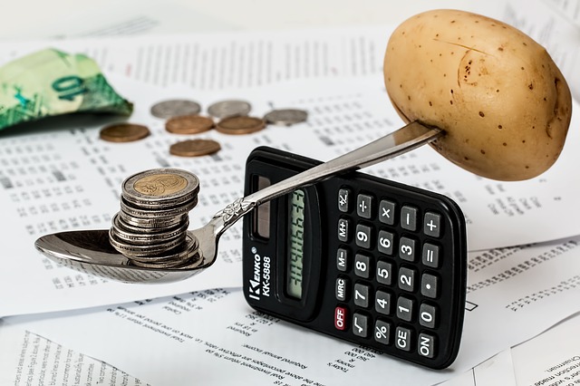 Money balancing out Potatoe over calculator