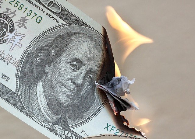 american dollar bill on fire