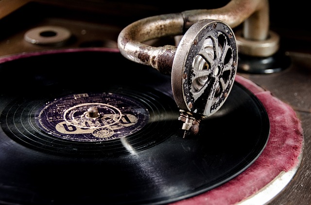 Old vinyl record playing with record. 