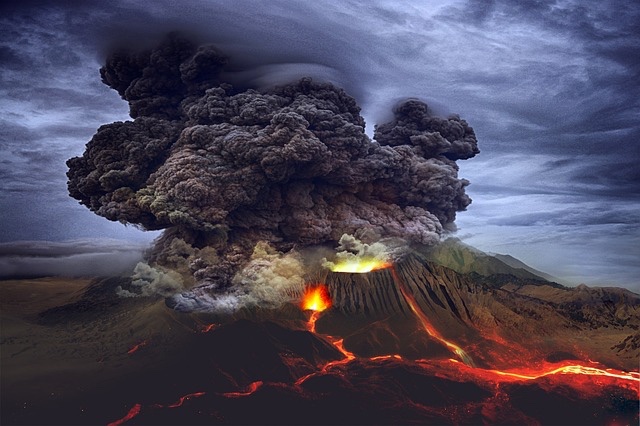 Volcano erupting with large cloud of smoke. 