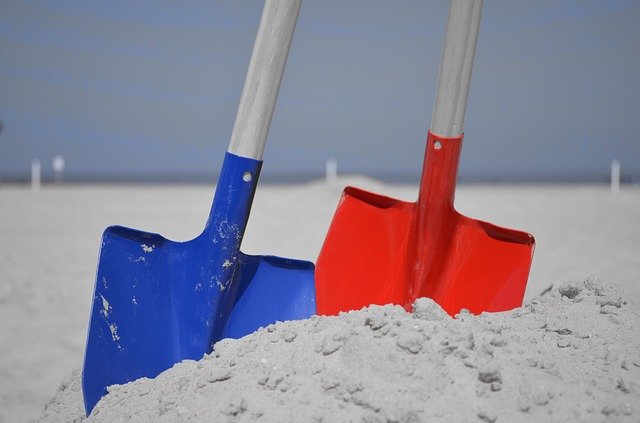 two shovels in the sand