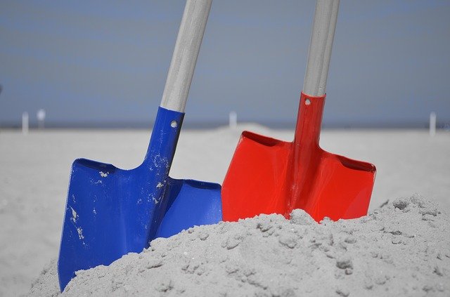 two shovels in the sand