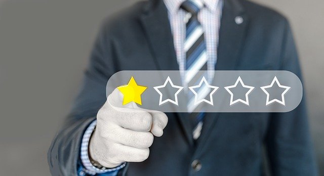 man in suit pressing 1 star out of 5